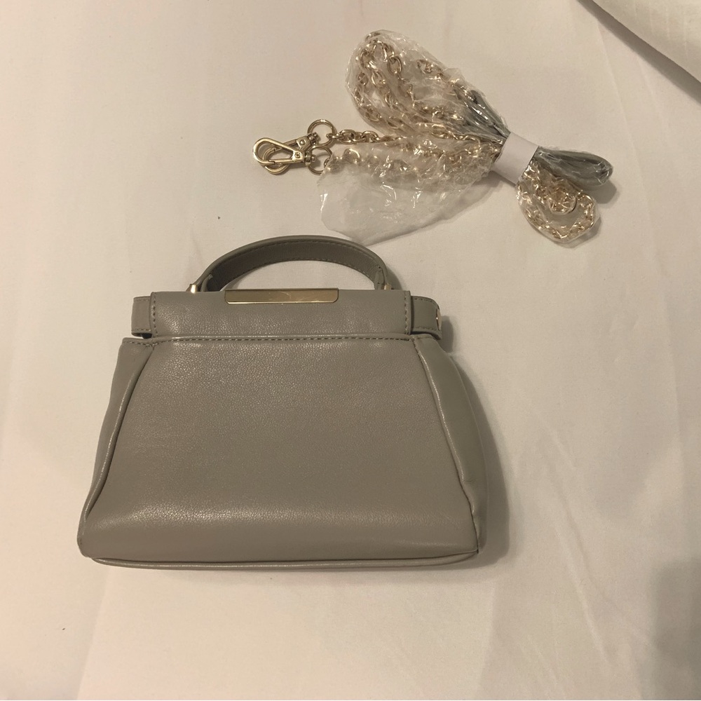 Cute taupe purse with gold detail and optional gold chain strap